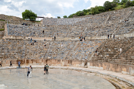 Ephesus, Turkey - 23 April: Tourists visiting the theater of Ephesus (Efes) with harbour street, Turkey.
