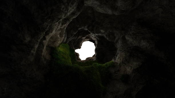 istock View from deep cave with grass, hole in rocky mountain, sunset. 3d render 1496333484