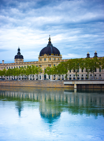 Lyon, France: The Rhone River, with the 18th-century Hotel Dieu and its reflection.