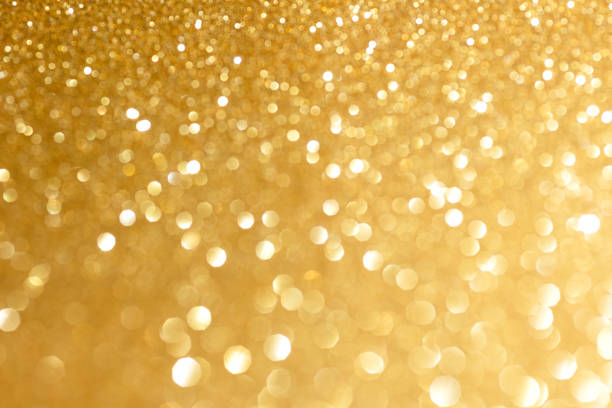 istock Golden glittering background for design and free space. 1496337507