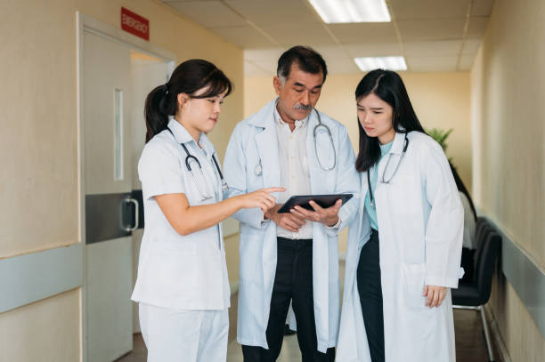 istock Decoding Complexity: A Doctor and Nurse Analyzing a Patient's Case at the Hospital 1496340211
