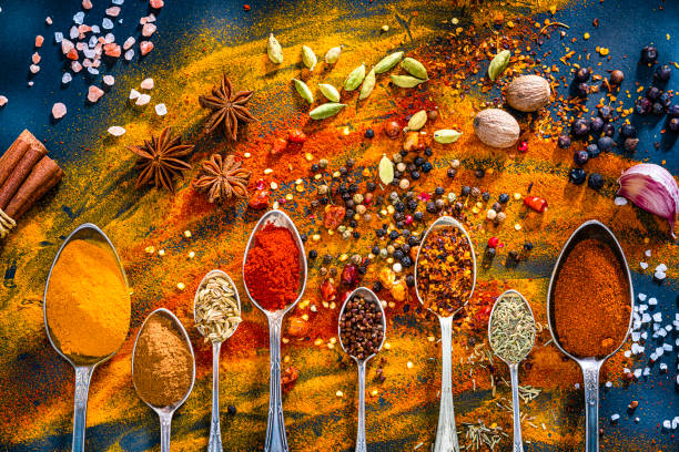istock Spoons full of colorful spices and condiments. 1496340341