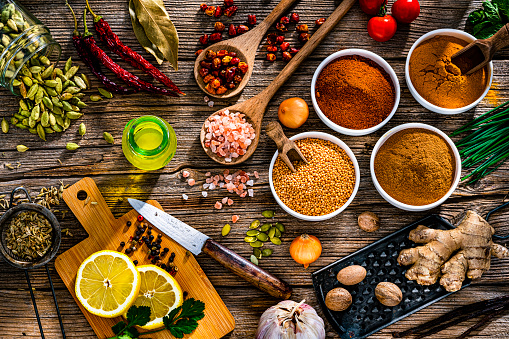 Fresh aromatic herbs and spices for cooking on wooden board