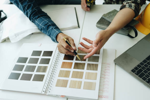 istock Engineers, designers and interior designers are finalizing the design of interiors by discussing selecting materials and colors to design rooms to present to clients. 1496340485