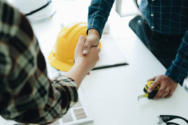 istock Engineers, designers and interior designers are handshake shack hands deal finalizing the design of interiors by discussing selecting materials and colors to design rooms to present to clients. 1496341546
