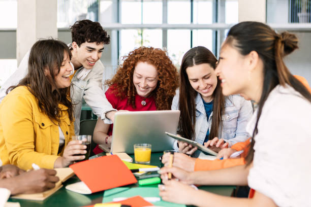 istock Diverse group of college students studying together at university cafeteria 1496342391