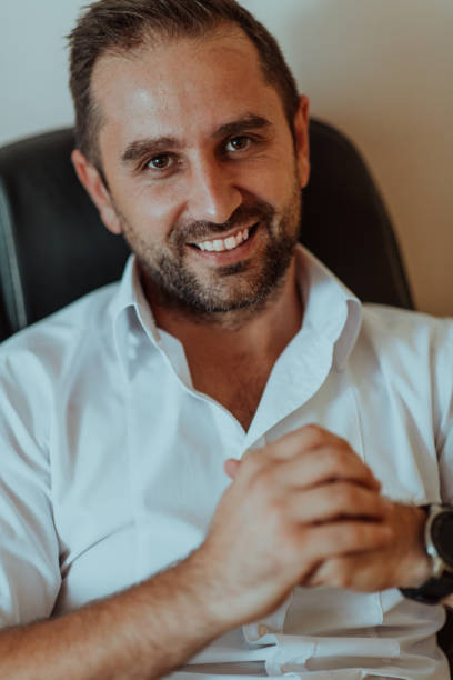 istock A successful businessman is sitting in his office after a hard day's work 1496342498