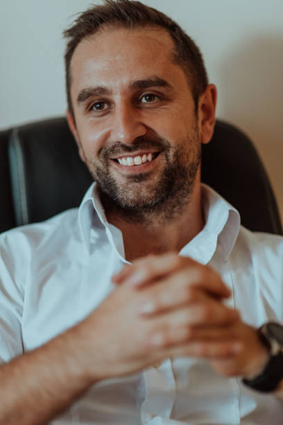 istock A successful businessman is sitting in his office after a hard day's work 1496342613