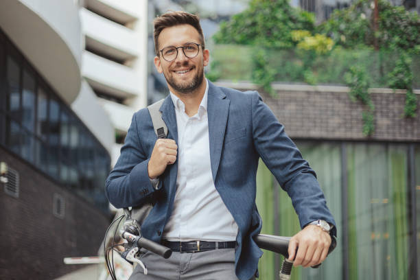 istock Businessman With Bicycle Looking at Camera 1496344969