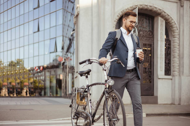 istock Businessman Commuting to Work With His Bicycle 1496345020