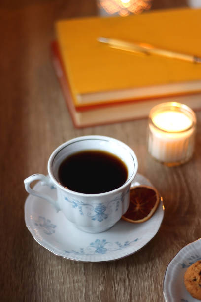 istock Books, Glasses, E-Reader, Pen, Tea, Cookies and Candles 1496346320
