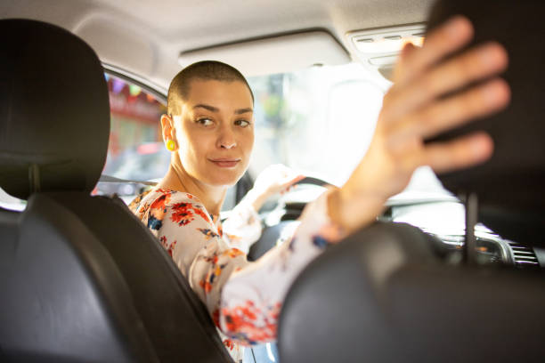 istock Woman is driving a car on her way to work 1496347148