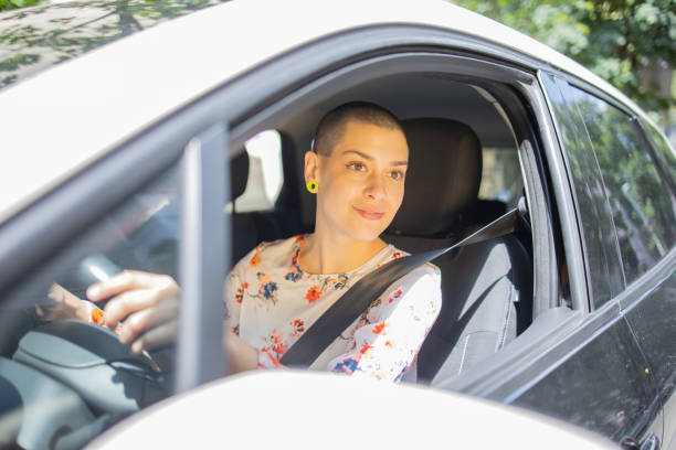 istock Young woman is driving a car 1496347150