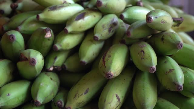 Nature is Bounty: Explore the Green and Fresh Bananas in the Local Store
