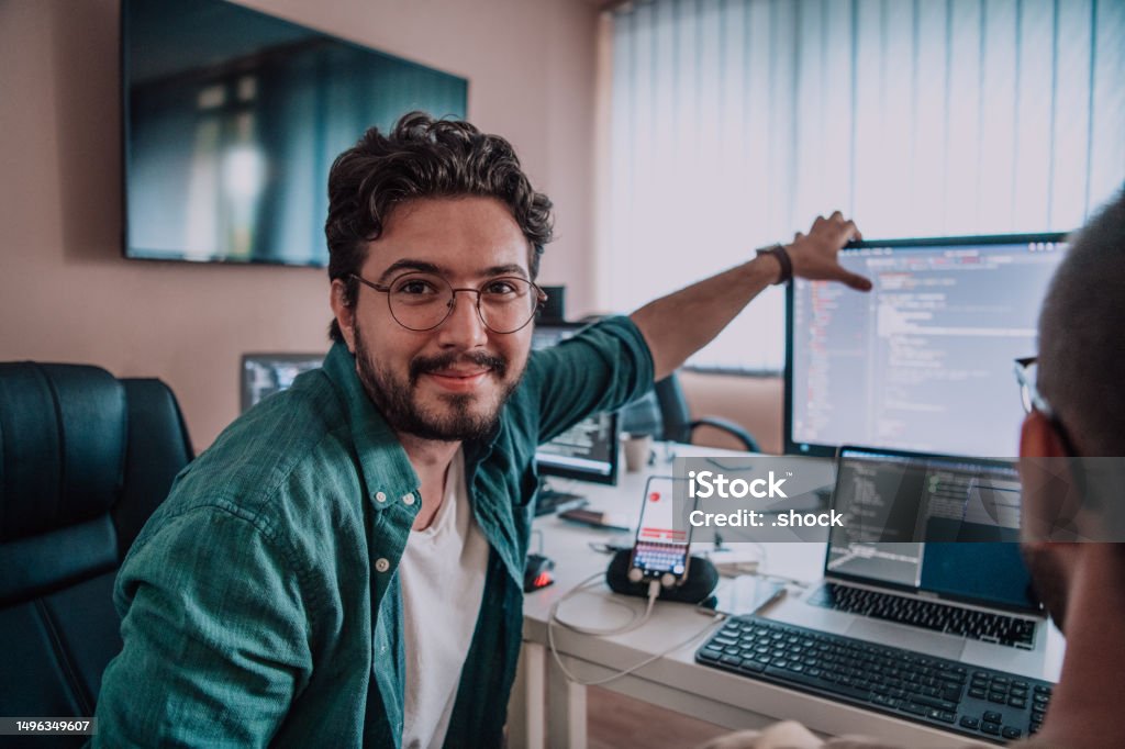 Two Programer Programmers Engrossed In Deep Collaboration Diligently Working Together ...