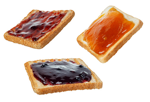 set of bread toasts with different types of jam isolated on white background