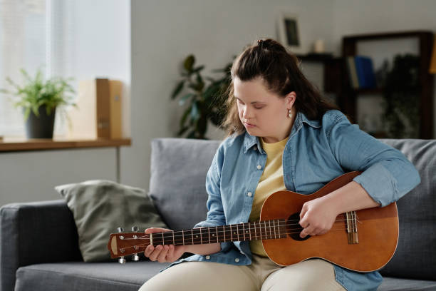 istock Girl learning to play guitar 1496352083