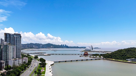 An elevated view of a large body of water with tall, modern buildings