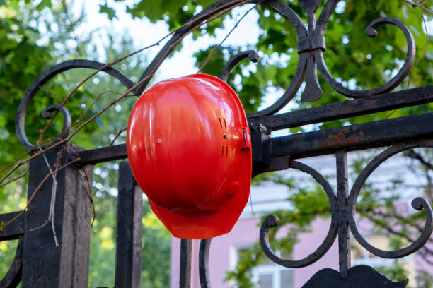 istock construction helmet on the fence 1496352474