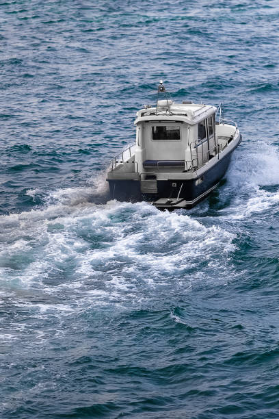istock Small fishing motor boat fast moving 1496354774