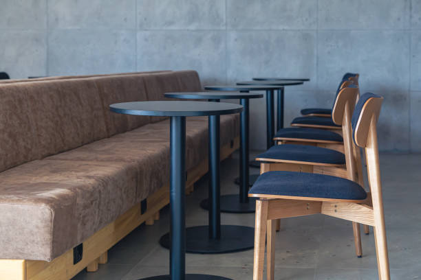 istock Interior of a modern cafe with sofas, chairs and tables. 1496356878