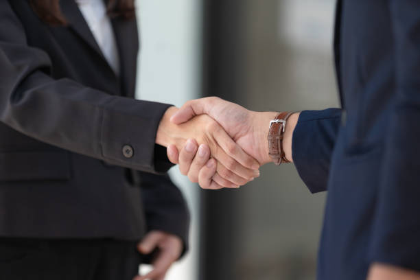 istock Man and woman are shaking hands in the office. Collaborative teamwork. 1496357168