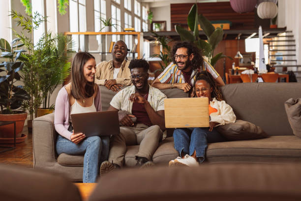 In a university campus office, surrounded by eager minds and the hum of intellectual curiosity, colleagues unite as students-turned-professionals, their collaborative endeavors fueling the pursuit of knowledge and the shaping of tomorrow's leaders