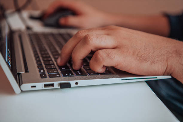 istock Close-up photo of a programmer typing on a laptop 1496357938