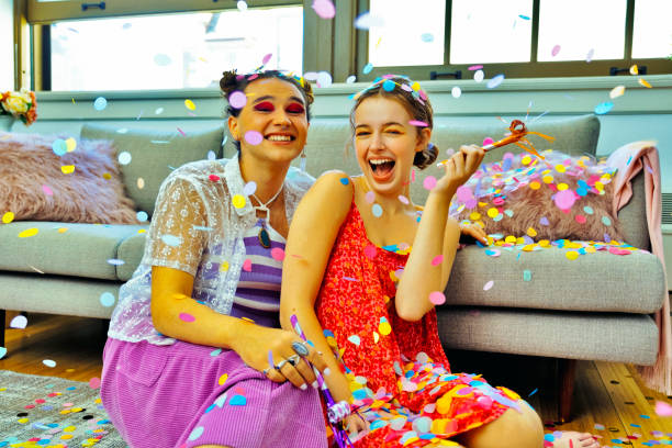 istock Friends with party blowers and confetti 1496359509
