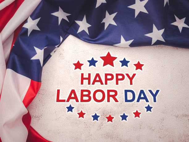 istock Happy labor day text over a cement floor background and American Flag. 1496360358