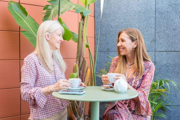 istock Friends enjoying and having fun over coffee on cafe terrace 1496362072