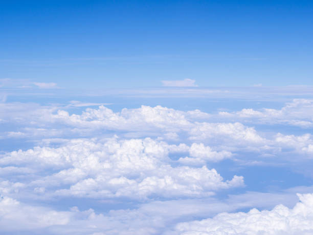 istock Beautiful view from airplane window above the clouds. 1496362133