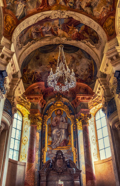 Chandelier and Windows of St. Nicholas Church which is a Czechoslovak Hussite Church Prague old town square, Czech Republic st nicholas church prague stock pictures, royalty-free photos & images