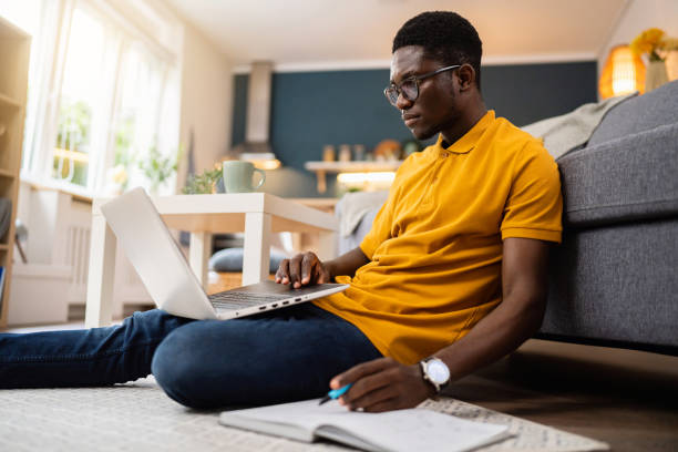 istock African-American male student e-learning at modern college dorm 1496369652