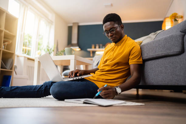 istock African-American male student e-learning at modern college dorm 1496369684