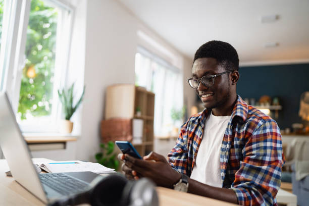 istock Man of African-American ethnicity working from modern home office 1496369700
