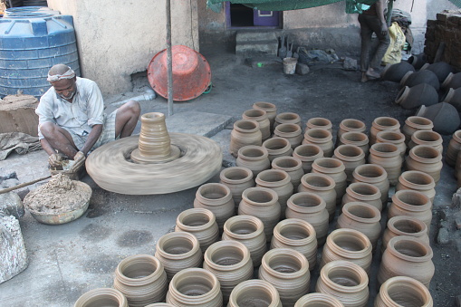 A man a making pottery in Mumbai maharashtra, India.