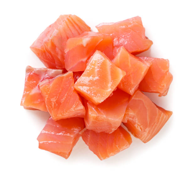 istock Pile of trout cubes on a white background. Top view 1496374832