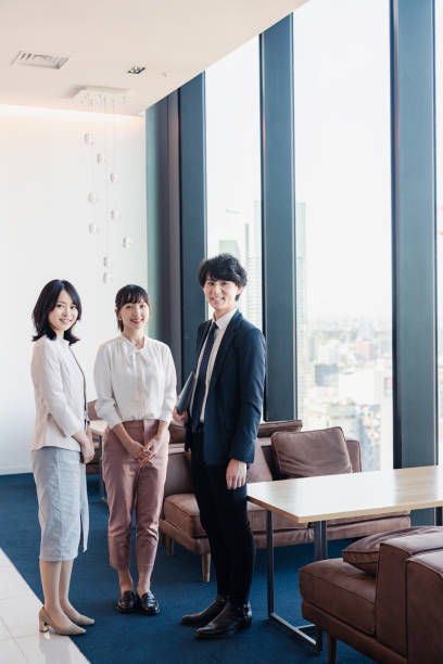 istock Young businesspeople talking friendly in an office 1496375104