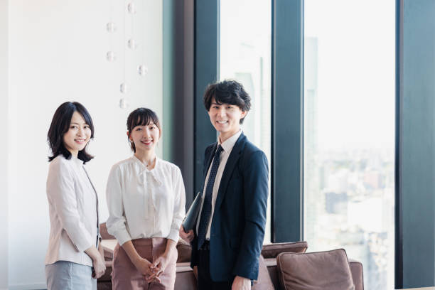 istock Young businesspeople talking friendly in an office 1496375107