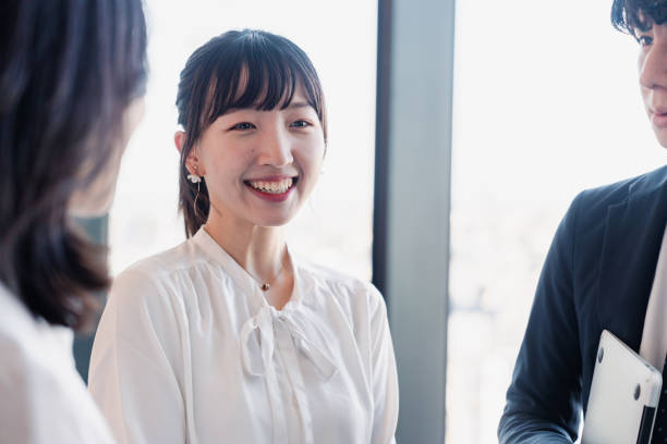 istock Young businesspeople talking friendly in an office 1496375111