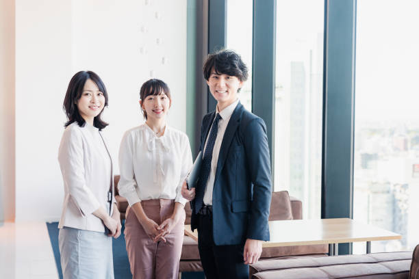 Young businesspeople talking friendly in an office