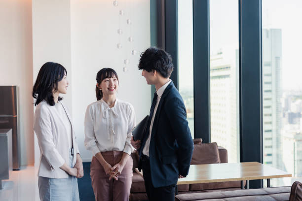 istock Young businesspeople talking friendly in an office 1496375120