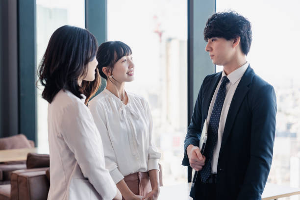 istock Young businesspeople talking friendly in an office 1496375124