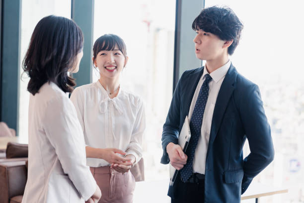 istock Young businesspeople talking friendly in an office 1496375126