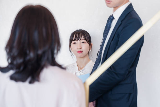 istock Young businesspeople talking friendly in an office 1496375168