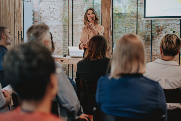 istock Woman presenting at a conference 1496375502