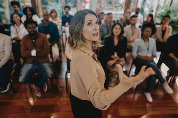 istock Woman presenting at a conference 1496375513
