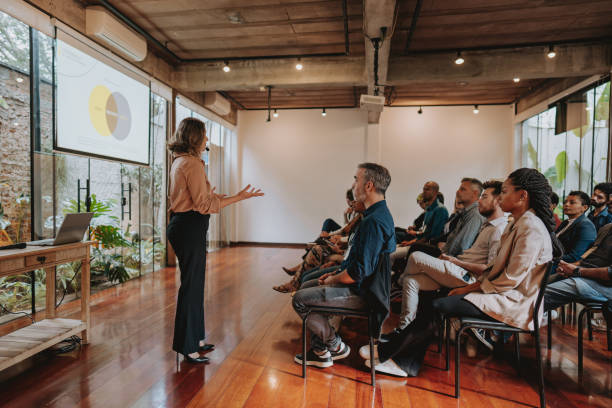 istock Woman presenting at a conference 1496375534