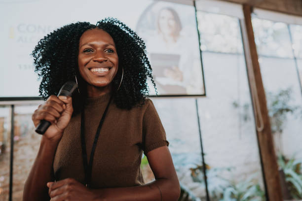 istock Woman giving speaker presentation 1496376900